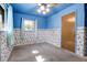 Cozy bedroom features wallpaper trim, blue ceiling, and natural light at 3354 W Arlington Ave, Littleton, CO 80123