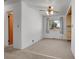 Bright dining area with neutral carpeting, a ceiling fan, and a large window at 3354 W Arlington Ave, Littleton, CO 80123