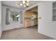 Bright dining space with a ceiling fan that transitions into the adjacent kitchen at 3354 W Arlington Ave, Littleton, CO 80123