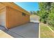 Wide driveway leads to a brick garage and a fenced parking area, providing ample parking at 3354 W Arlington Ave, Littleton, CO 80123