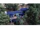 Aerial view of home featuring beautiful architecture surrounded by mature trees at 2857 Linden Dr, Boulder, CO 80304