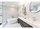 Modern bathroom featuring a soaking tub, glass shower, and double sink vanity at 2857 Linden Dr, Boulder, CO 80304