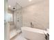 Bathroom featuring a modern soaking tub and shower with frameless glass doors at 2857 Linden Dr, Boulder, CO 80304