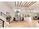 Bright dining room features wood floors, vaulted ceiling with wooden beams, modern lighting and views to the outdoors at 2857 Linden Dr, Boulder, CO 80304