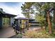 Contemporary home with a gray exterior, featuring a stone patio and ample windows for natural light at 2857 Linden Dr, Boulder, CO 80304