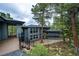 Home exterior with modern landscaping and a large deck, surrounded by mature trees at 2857 Linden Dr, Boulder, CO 80304