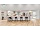 Spacious kitchen featuring modern white cabinets, stainless appliances, and a breakfast bar at 2857 Linden Dr, Boulder, CO 80304