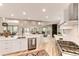 Bright, open-concept kitchen with stainless steel appliances, center island and wood floors at 2857 Linden Dr, Boulder, CO 80304