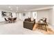 Cozy living room with neutral carpet, a sectional sofa, and a dining area with a round table at 2857 Linden Dr, Boulder, CO 80304