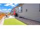 Backyard with artificial turf and a patio including outdoor furniture and barbecue at 7404 Greenwater Cir, Castle Rock, CO 80108