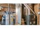Goodman furnace with a hot water heater and ductwork in the basement at 7404 Greenwater Cir, Castle Rock, CO 80108