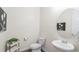 Cozy powder room with pedestal sink, modern fixtures, and decorative accents at 7404 Greenwater Cir, Castle Rock, CO 80108