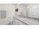 Granite countertop vanity with shower and toilet offers a sleek design and ample space at 7404 Greenwater Cir, Castle Rock, CO 80108
