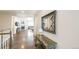 Elegant entryway featuring hardwood floors and staircase, leading into the expansive living area at 7404 Greenwater Cir, Castle Rock, CO 80108