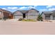 Charming single-Gathering home featuring stone accents, a well-kept lawn, and an attached two-car garage at 7404 Greenwater Cir, Castle Rock, CO 80108