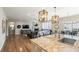 Open-concept kitchen flowing into a spacious living area, perfect for modern living and entertaining guests at 7404 Greenwater Cir, Castle Rock, CO 80108