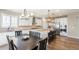 Bright kitchen with modern appliances, a spacious island, and dining area, perfect for Gathering gatherings at 7404 Greenwater Cir, Castle Rock, CO 80108