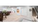 Large living room with open floor plan, stairs to upper level, and storage closet at 7404 Greenwater Cir, Castle Rock, CO 80108