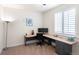 Home office featuring a corner desk, large window, and comfortable office chair at 7404 Greenwater Cir, Castle Rock, CO 80108