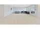 Expansive basement featuring neutral carpeting, ample lighting, and space for flexible living at 3425 W 111Th Loop # B, Westminster, CO 80031