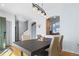Cozy dining room featuring wood floors, modern lighting, and adjacent kitchen view at 3425 W 111Th Loop # B, Westminster, CO 80031