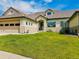 Charming home with a well-maintained lawn, tile roof, attached garage, and inviting front entrance at 3425 W 111Th Loop # B, Westminster, CO 80031