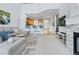 Open-concept living room with modern gray furniture and a fireplace at 3425 W 111Th Loop # B, Westminster, CO 80031