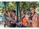 A lively band performing outdoors, featuring brass instruments and cheerful musicians at 7883 W 55Th Ave, Arvada, CO 80002