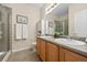 Well-lit bathroom with double sink vanity, neutral colors, and walk-in shower at 7883 W 55Th Ave, Arvada, CO 80002