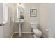 Charming bathroom featuring pedestal sink, neutral walls, and updated fixtures at 7883 W 55Th Ave, Arvada, CO 80002