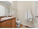 Neutral bathroom with updated fixtures, modern mirror, and shower at 7883 W 55Th Ave, Arvada, CO 80002
