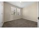 Neutral bedroom with plush carpet, bright windows, and ample natural light at 7883 W 55Th Ave, Arvada, CO 80002