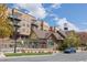 Attractive community space with pool, townhomes and recreation center near parking, and water tower at 7883 W 55Th Ave, Arvada, CO 80002