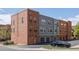 Exterior view showing the row of attached garages of a modern townhome complex at 7883 W 55Th Ave, Arvada, CO 80002