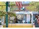 Sweet Gold Spice Co. food stand with cold-pressed juices and hanging floral baskets at 7883 W 55Th Ave, Arvada, CO 80002