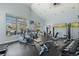 Bright gym with modern equipment and large windows offering inspiring views of the neighborhood at 7883 W 55Th Ave, Arvada, CO 80002