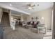 Inviting living space with open layout to kitchen and stairs, perfect for entertaining at 7883 W 55Th Ave, Arvada, CO 80002
