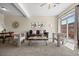 Bright living room featuring modern decor, balcony access, and a comfortable seating arrangement at 7883 W 55Th Ave, Arvada, CO 80002