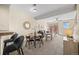 Open-concept living and dining area with modern furnishings and a cozy ambiance at 7883 W 55Th Ave, Arvada, CO 80002