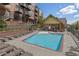 Inviting swimming pool with lounge chairs and seating areas perfect for relaxation and community gathering at 7883 W 55Th Ave, Arvada, CO 80002