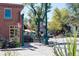 Charming street scene with outdoor dining, American flags, and a lively atmosphere in a quaint neighborhood at 7883 W 55Th Ave, Arvada, CO 80002