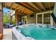 Backyard patio featuring hot tub, offering a relaxing outdoor space at 10305 Charissglen Cir, Highlands Ranch, CO 80126