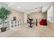 Basement with workout equipment and a bright window, offering a fitness space at 10305 Charissglen Cir, Highlands Ranch, CO 80126