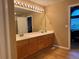 Spacious bathroom featuring a double sink vanity with views of the bedroom at 10305 Charissglen Cir, Highlands Ranch, CO 80126