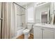 Bright bathroom featuring a tub shower, and vanity with a white countertop sink at 10305 Charissglen Cir, Highlands Ranch, CO 80126