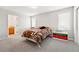 Well-lit bedroom featuring an ensuite bathroom and two bright windows at 10305 Charissglen Cir, Highlands Ranch, CO 80126