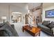 Spacious living room with an open layout, a staircase, and comfortable furnishings at 10305 Charissglen Cir, Highlands Ranch, CO 80126