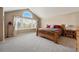 Spacious main bedroom with a large window and plenty of natural light at 10305 Charissglen Cir, Highlands Ranch, CO 80126