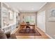 Bright home office with hardwood floors, custom built-ins, natural light, and a closet at 10305 Charissglen Cir, Highlands Ranch, CO 80126