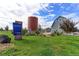 Community park with barn structure and lush green space at 5154 Bittercress Rd, Brighton, CO 80640